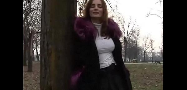  Stunning milf with nice tits flashing in a park